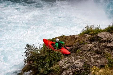 Kayaker for launching into mountain river rapids Stock Photos