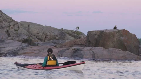 Kayaker looking at eagle Stock Footage 144787031