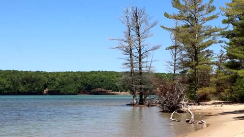 Kayaker Paddling Along Sand Point Beach at Pictured Rocks National Lakeshore Stock Footage 140071644