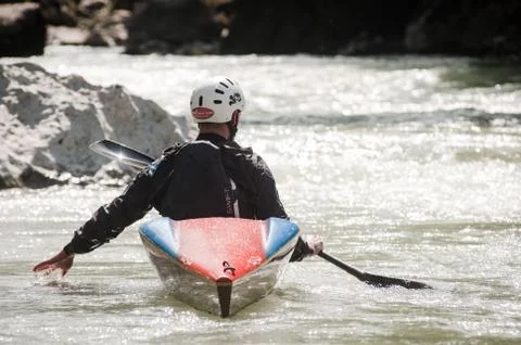 Kayaker is relaxing on a beautyfull wild river Stock Photos