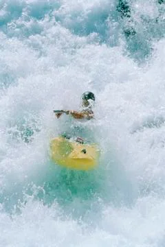 Kayaker rowing in rapids Stock Photos