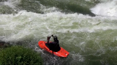 Kayaker rowing on the wild waters of the White Nile Stock Footage 44333684