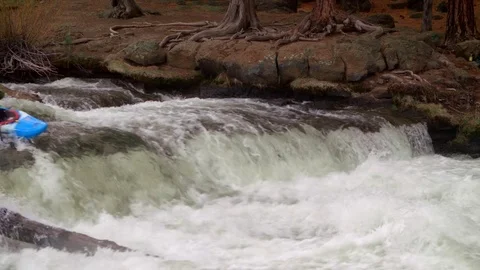 Kayaker shoots powerful waterfall Stock Footage 83204069
