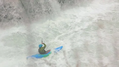 Kayaker shoots powerful waterfall 스톡 동영상 83204639