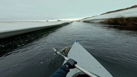 Kayaker spends vacation sailing on ice canoe past glaciers Stock Footage 208342269