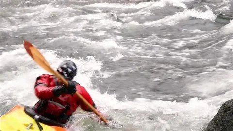 Kayaker threads a needle on rapids of Winnipesaukee River Stock Footage 93515876
