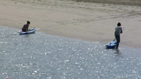 Kayakers on beach Stock Footage 124715
