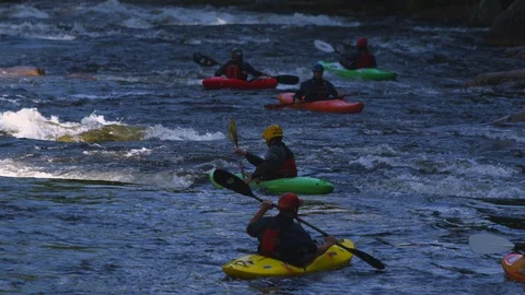 Kayakers kayaking in the river Stock Footage 103825138