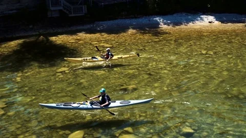 Kayakers Paddling By Over Clear Water In Door County, WI Stock Footage