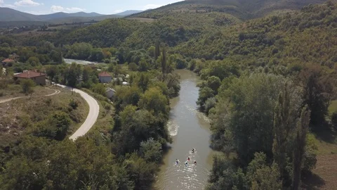 Kayakers at river valley Stock Footage 129248548