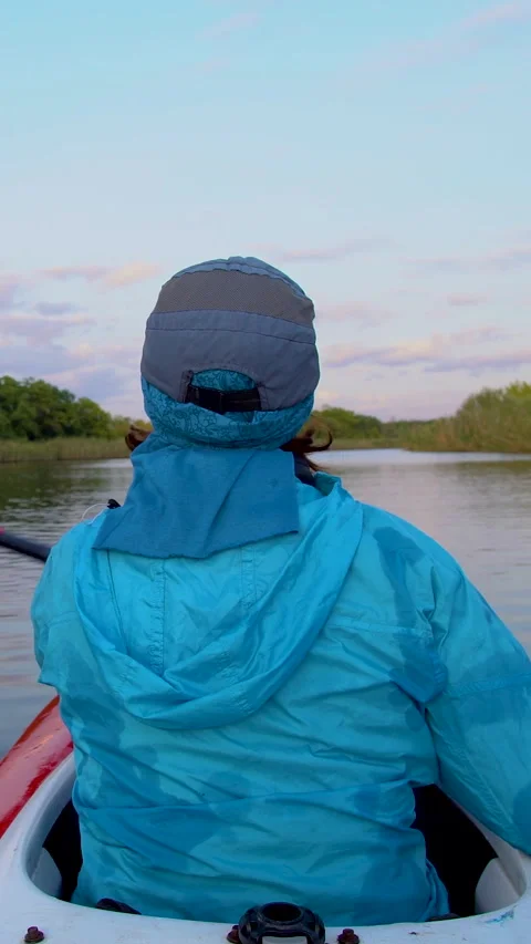Kayaking adventure on a calm river surrounded by lush greenery Stock Footage 314156104