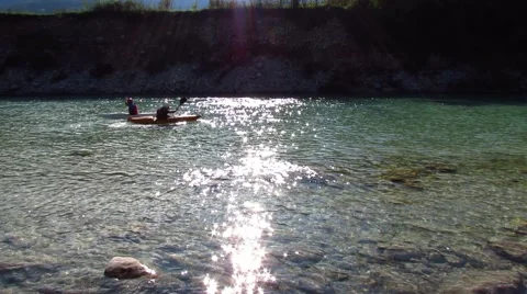 Kayaking against the current in calm river Stock Footage 42538142