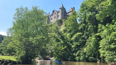 Kayaking along Lesse River under the Walzin Castle Stock Footage 90229614
