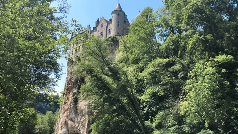 Kayaking along Lesse River under the Walzin Castle Stock Footage 90251315
