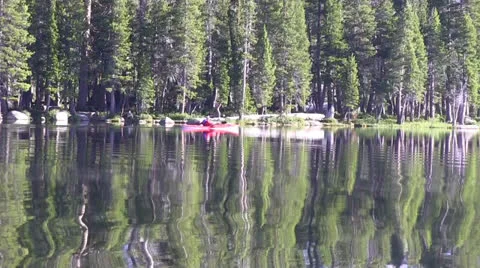 Kayaking on alpine lake Stock Footage 25590584