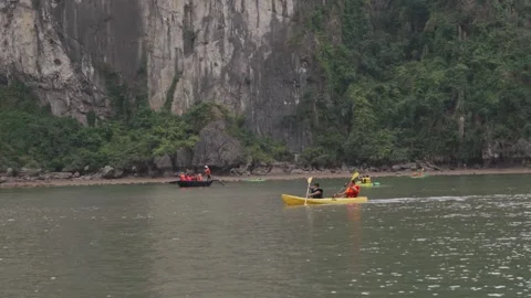 Kayaking Boating Limestone Cliffs Caves Lagoons Ha Long Bay, Vietnam Stock Footage 329010562