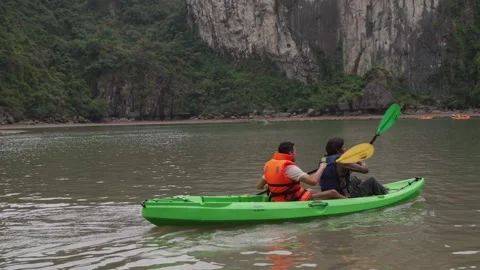 Kayaking Boating Limestone Cliffs Caves Lagoons Ha Long Bay, Vietnam Stock Footage 329010589