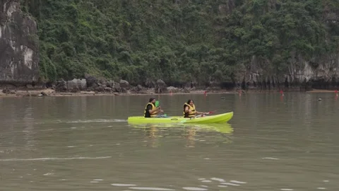 Kayaking Boating Limestone Cliffs Caves Lagoons Ha Long Bay, Vietnam Stock Footage 329010667