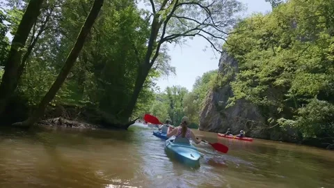 Kayaking on a Calm River in Summer With Friends Enjoying Nature Stock Footage 335998949