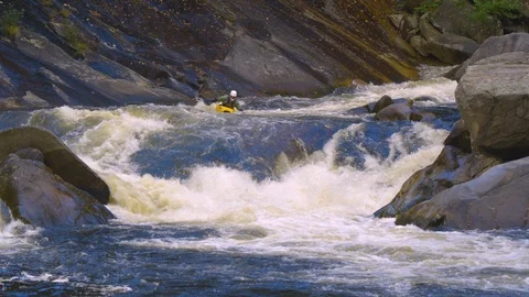 Kayaking on the fast moving river Wilson’s Creek. NC Stock Footage 103823320