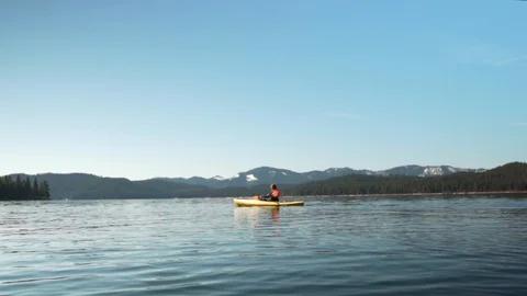 Kayaking on Glassy Lake Stock Footage 128211523