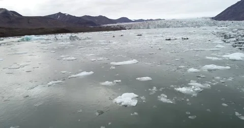 Kayaking with iceberg, ice and glacier on Svalbard in the high Arctic overpass Stock Footage 146980376