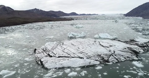 Kayaking with iceberg, ice, slush and glacier on Svalbard in the high Arctic Stock Footage 146978516