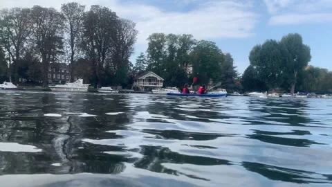 Kayaking at Kingston upon Thames viewed from swimming Stock Footage 139623499
