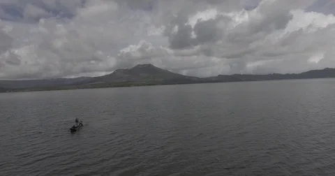 Kayaking on lake towards mountain Stock-Footage 71829609
