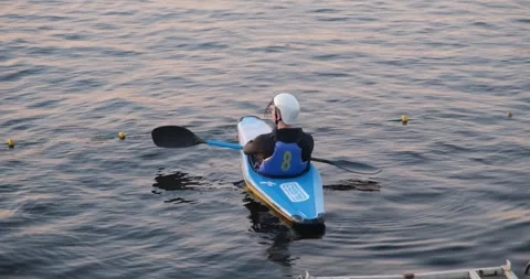 Kayaking. A man in a kayak with oars rests during the break of the competition. Stock Footage 246385877