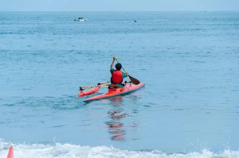 Kayaking. Man paddling a kayak. Stock Photos