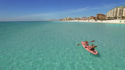 Kayaking in Ocean Along Beach Stock Footage 61298865