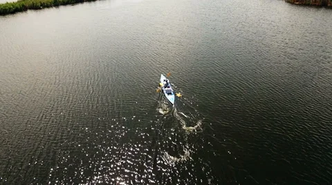 Kayaking on the river between the reeds Stock Footage 64345325
