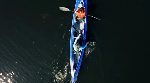 Kayaking on the river between the reeds Stock Footage 64346071