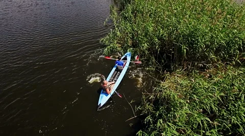 Kayaking on the river between the reeds Stock Footage 64346872