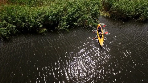 Kayaking on the river between the reeds Stock Footage 64350000