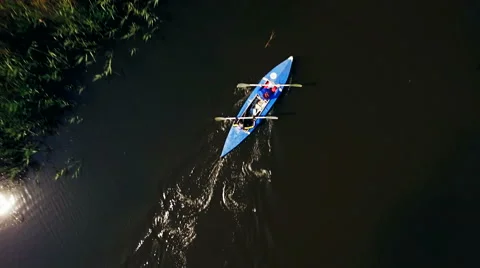 Kayaking on the river between the reeds Stock Footage 64353888