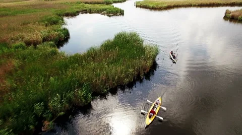 Kayaking on the river between the reeds Stock Footage 64356098