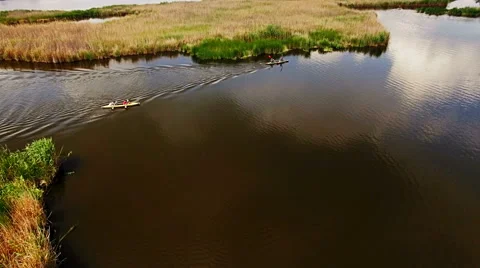 Kayaking on the river between the reeds Stock Footage 64356546