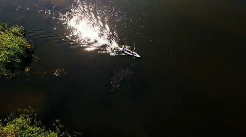 Kayaking on the river between the reeds Stock Footage 64360437