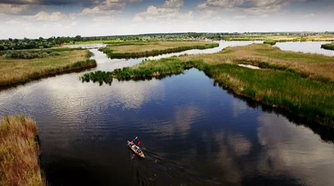 Kayaking on the river between the reeds Stock Footage 64361321