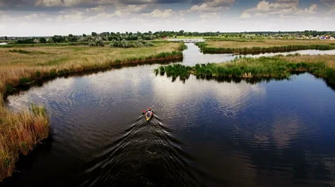 Kayaking on the river between the reeds Stock Footage 64362213