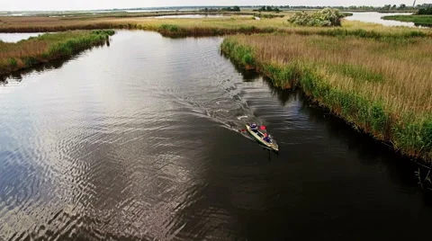 Kayaking on the river between the reeds Stock Footage 64363981