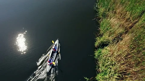 Kayaking on the river between the reeds Stock Footage 64365725