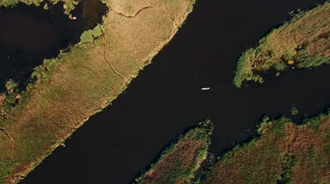 Kayaking on the river between the reeds Stock Footage 64378169
