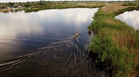 Kayaking on the river between the reeds Stock Footage 64516218