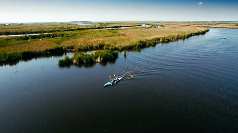 Kayaking on the river between the reeds Stock Footage 64517287