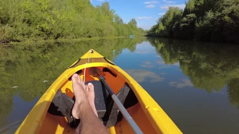 Kayaking on the river, first-person view while kayaking on a small river Video stock 203881298