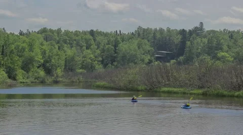 Kayaking on a River Vista Daytime Stock Footage 65320558