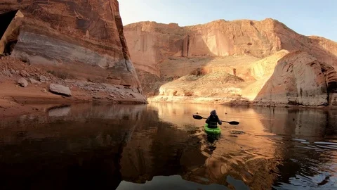 Kayaking Smooth Water with Red Cliffs and Blue Sky Stock Footage 88234681